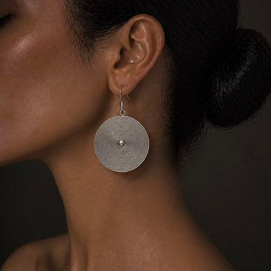 Handcrafted Miao Silver Spiral Disc Earrings – Minimalist Ethnic Statement Jewelry | Orithing