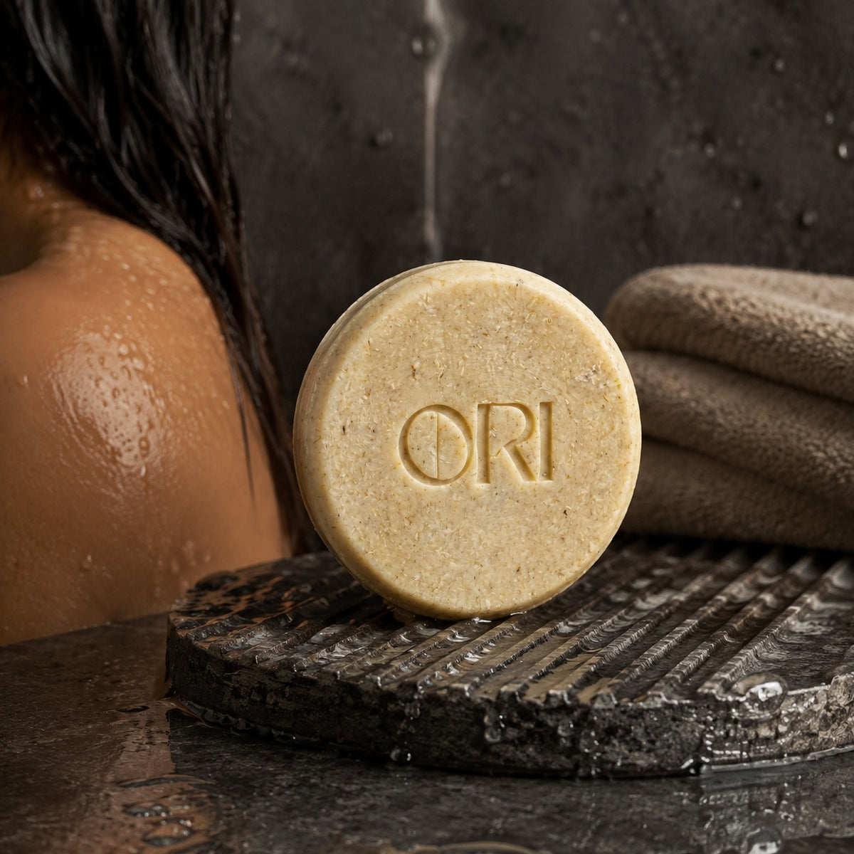 Ginger and astragalus shampoo bar: Beside wet hair and folded towels