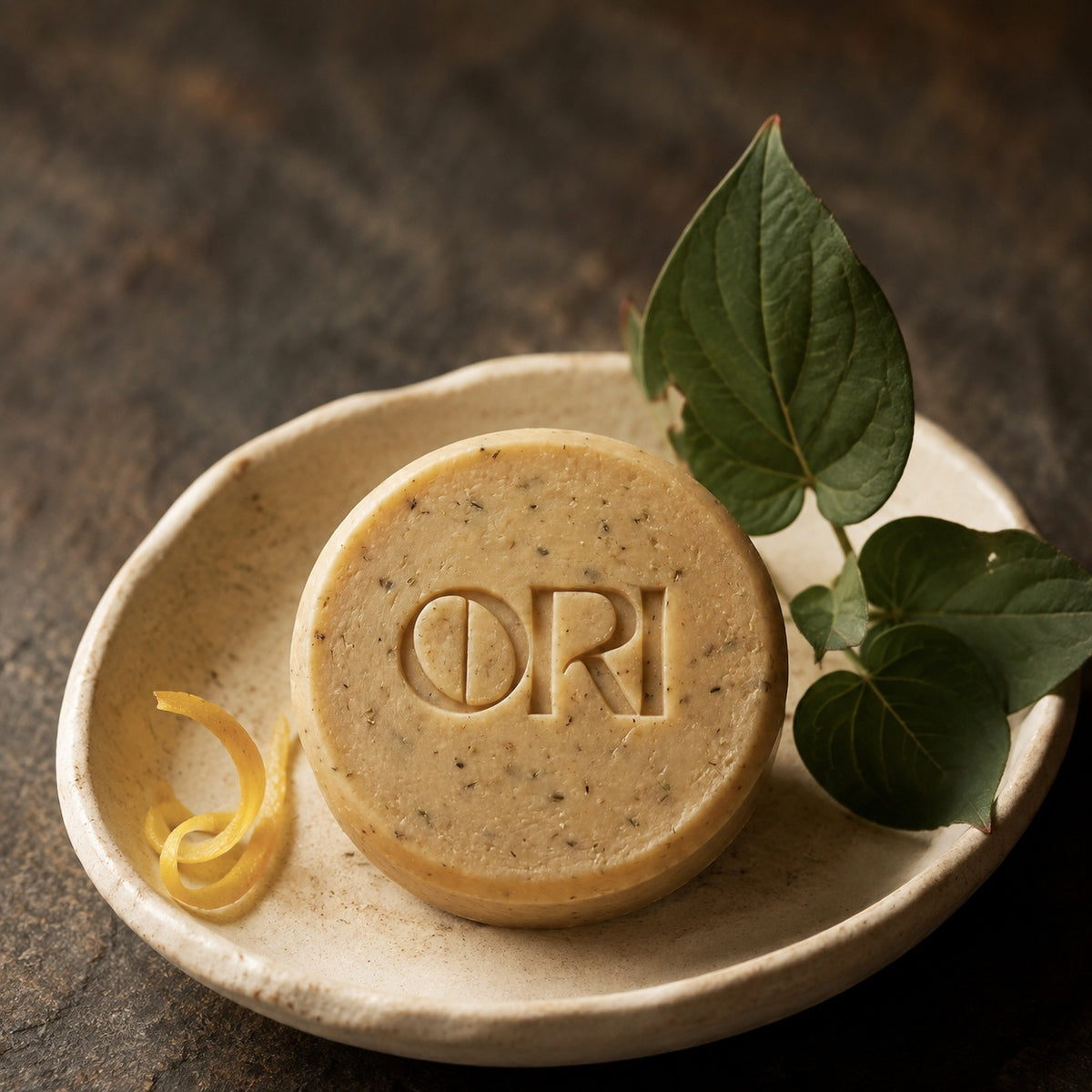 Heartleaf and goat milk soap bar: In a ceramic bowl with lemon peel