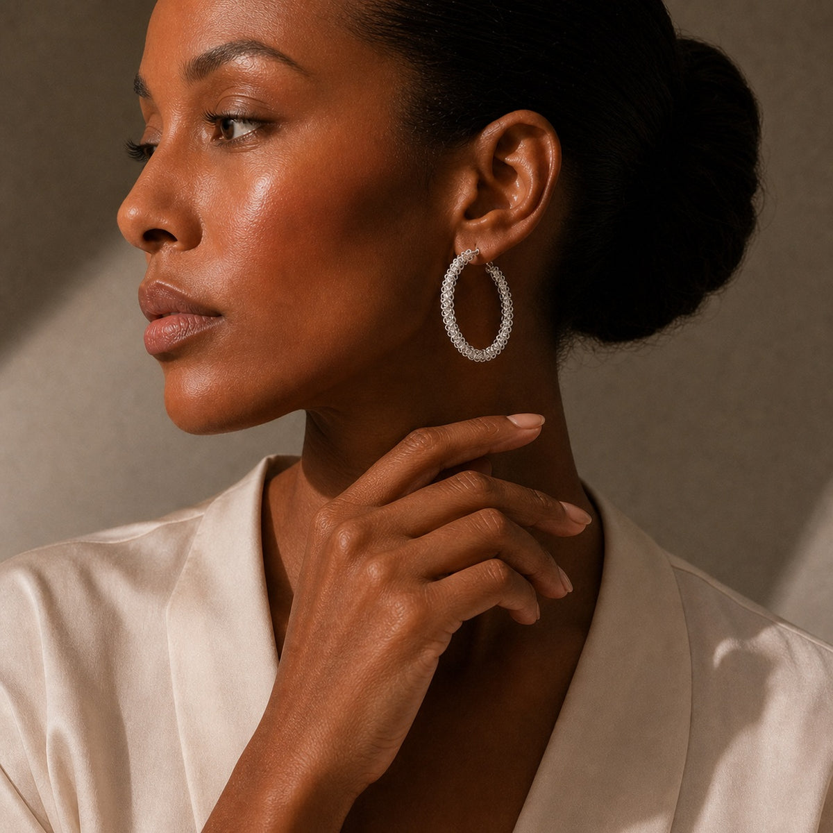 Miao silver hoop earrings: Side portrait showing the hoop earring