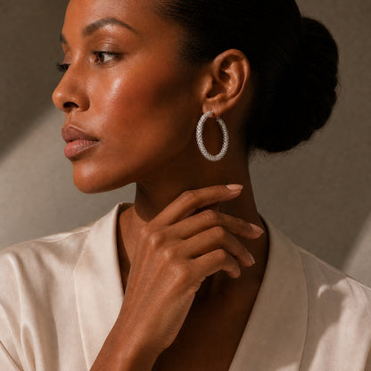 Miao silver hoop earrings: Side portrait showing the hoop earring