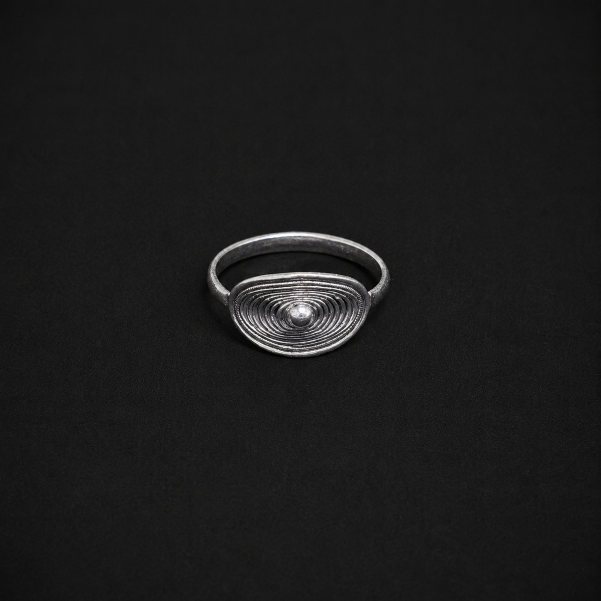 Miao silver oval filigree ring: Angled view showing the oval face and band
