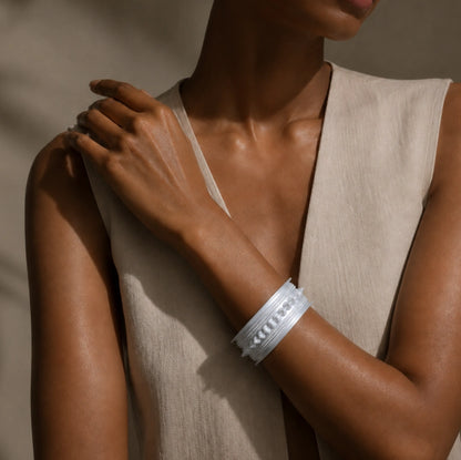 Miao silver patterned bracelet: Wide bracelet worn with a pale sleeveless top