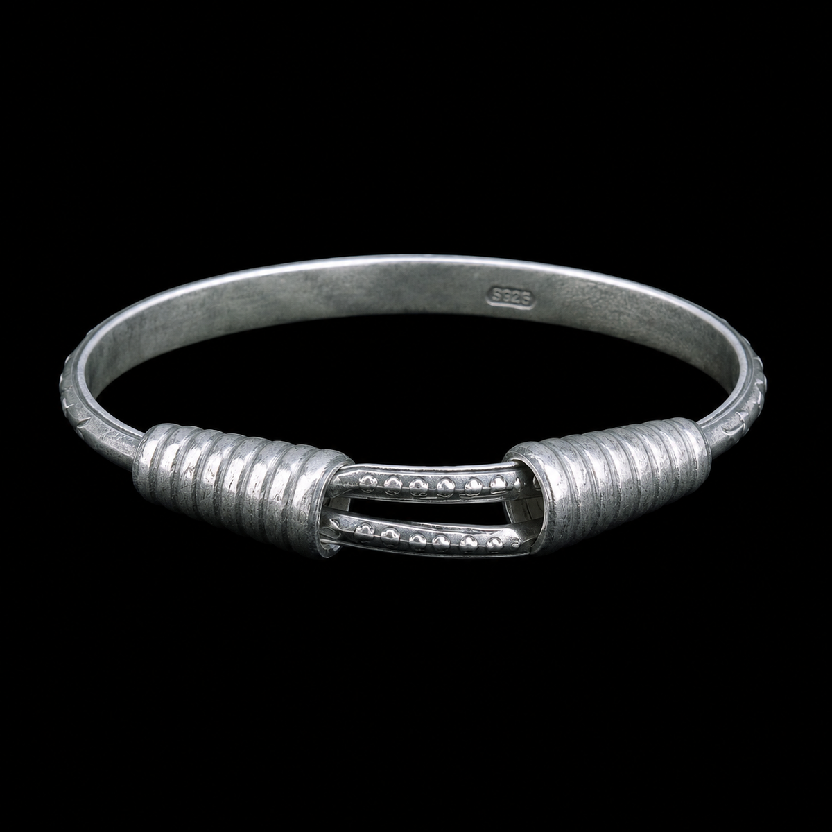 Miao silver spiral bracelet: Front view of coiled ends and slender band