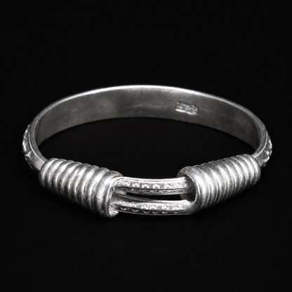 Miao silver spiral bracelet: Front view of coiled ends and wider band