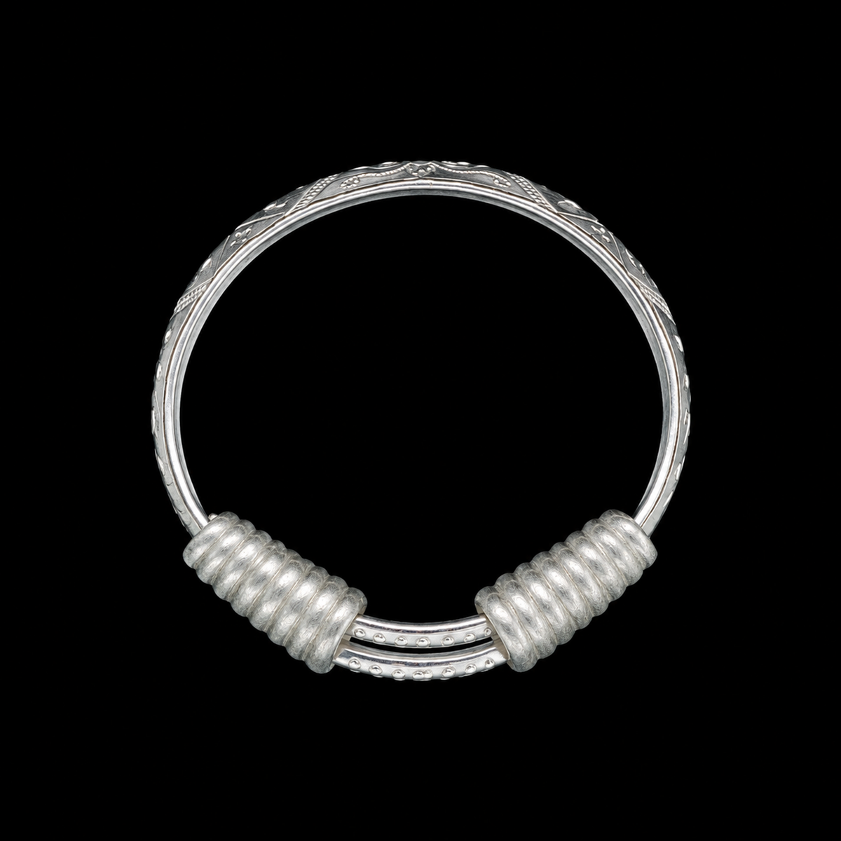 Miao silver spiral bracelet: Round engraved bracelet on a black background