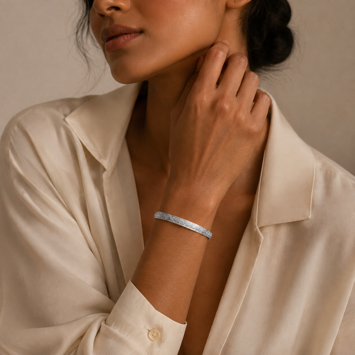 Miao silver spiral bracelet: Slim spiral bracelet worn with a pale blouse