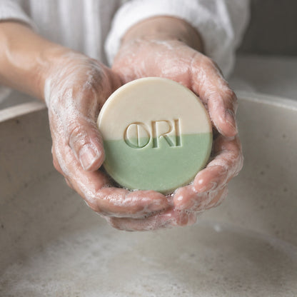 Peppermint and goat milk soap bar: Held in lathered hands