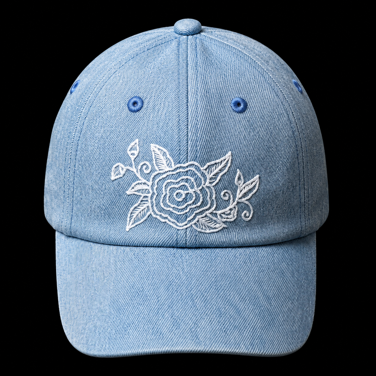 Qiang embroidered denim baseball cap: Front view showing white floral embroidery and curved brim