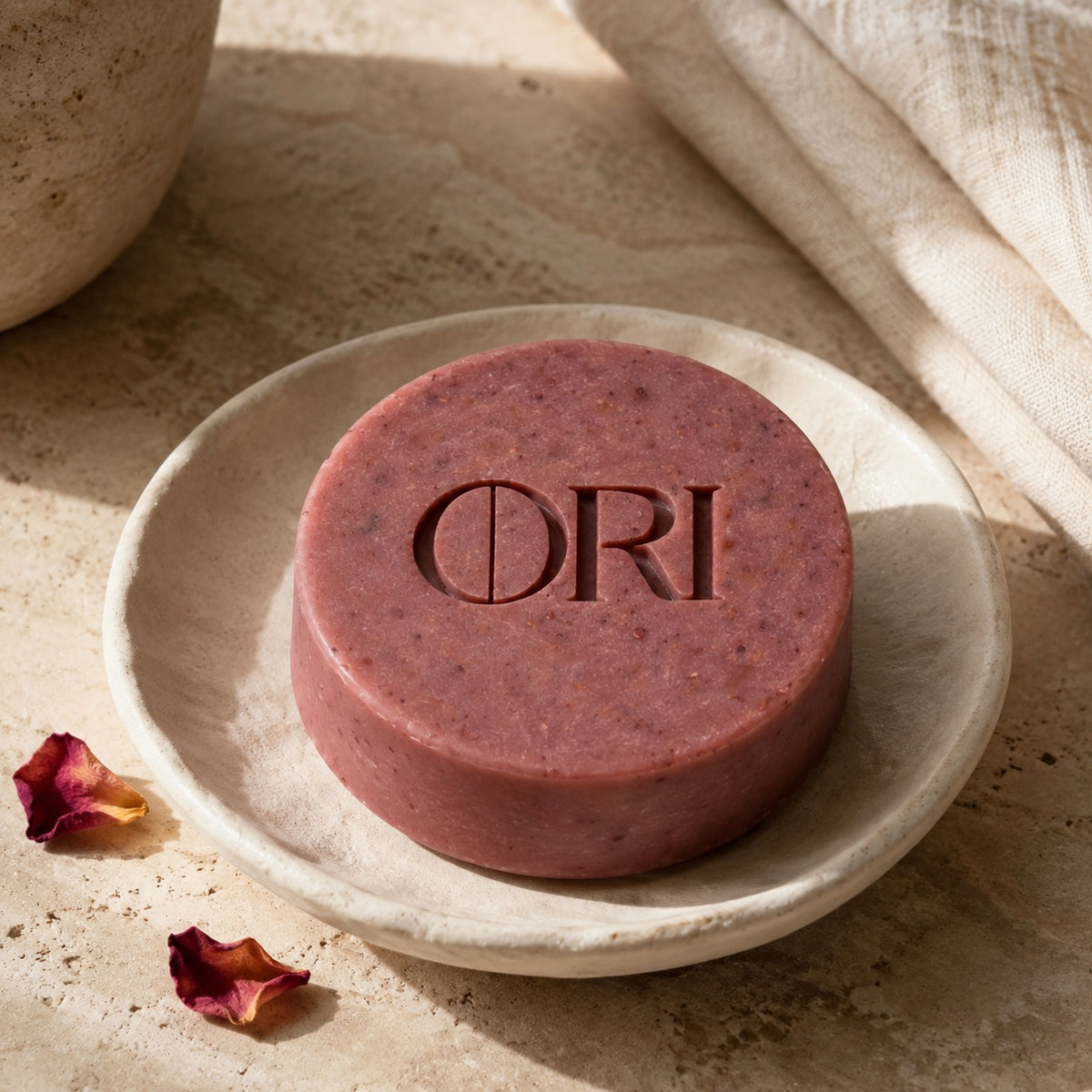 Rose milled soap bar: Lying on a pale soap dish