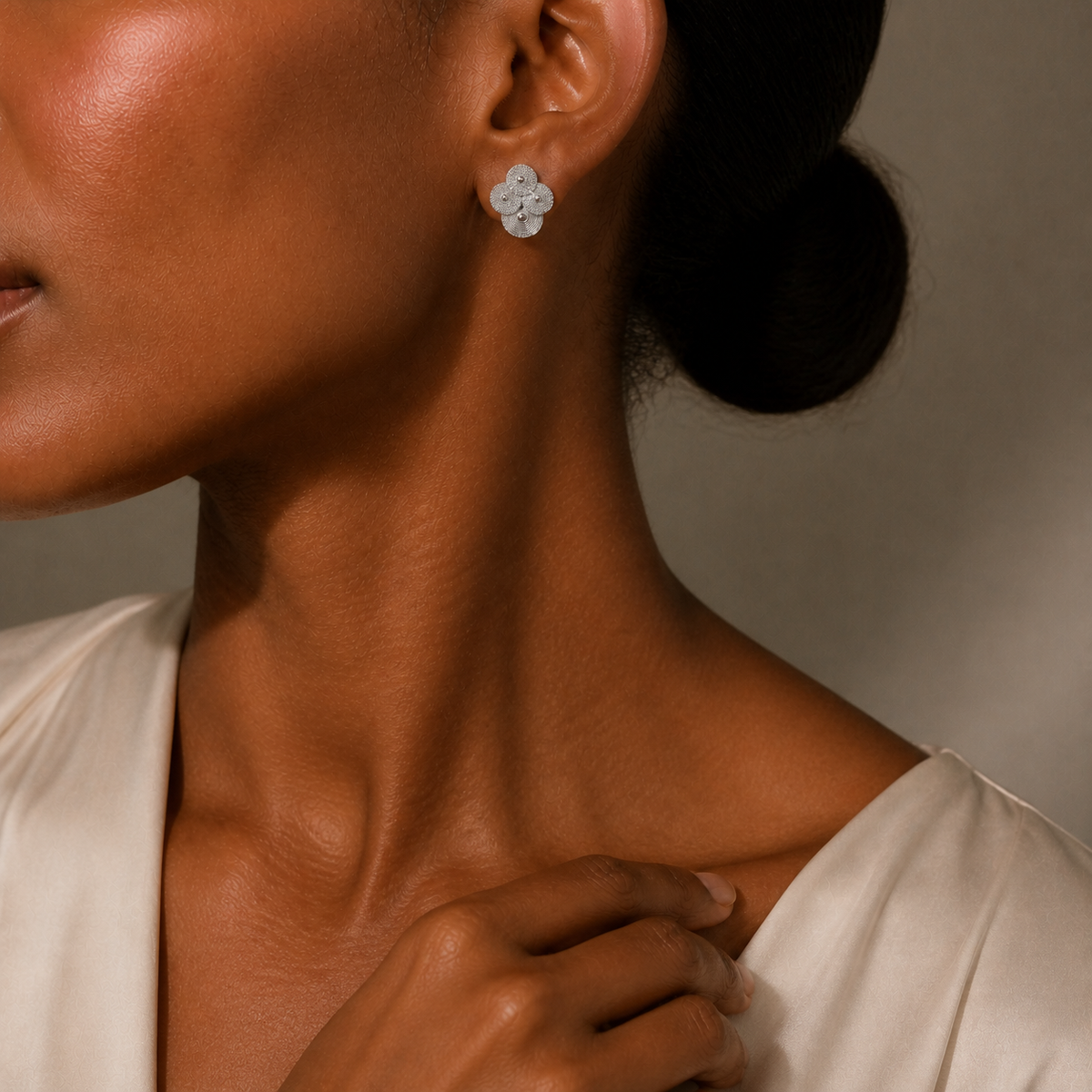 Silver spiral-disc cluster studs: Cluster stud worn with a pale blouse