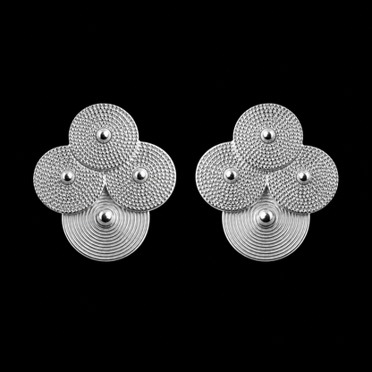 Silver spiral-disc cluster studs: Front view of the cluster stud pair on black