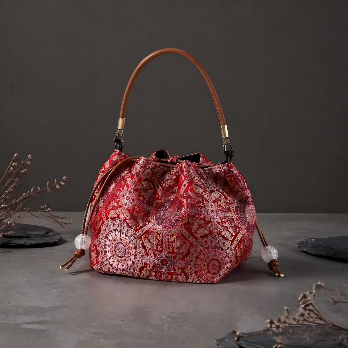 Song brocade bucket bag: Red patterned bag with top handle on slate