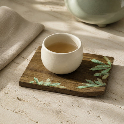 Square walnut cloisonne coaster: Green leaf design beneath a white cup