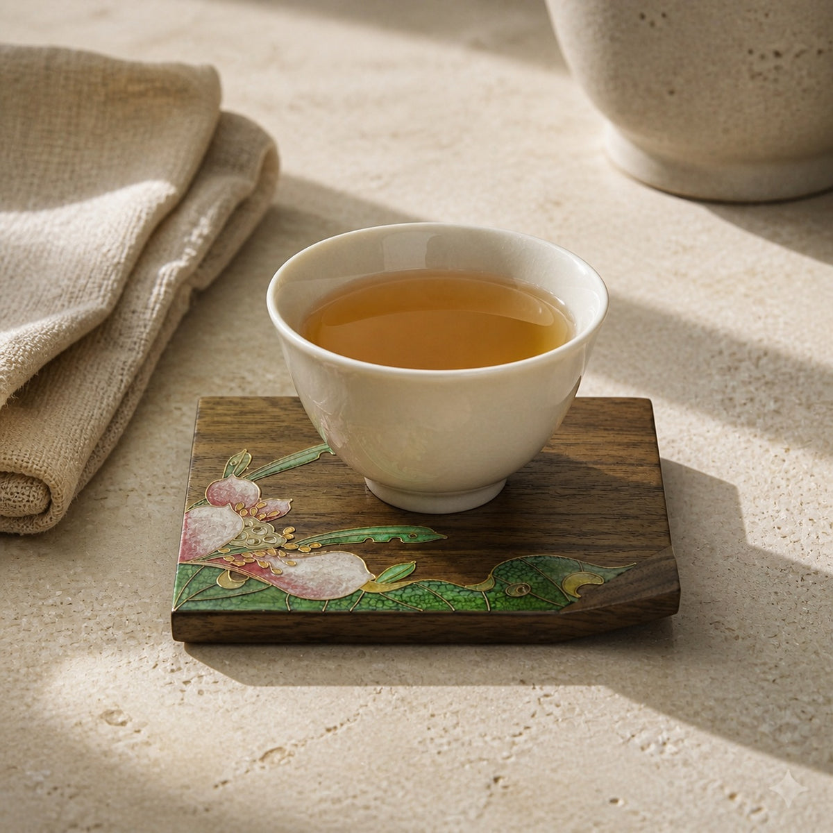 Square walnut cloisonne coaster: Pink floral design beneath a white cup