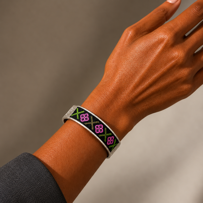 Xixiu embroidered alloy cuff: Geometric cuff worn on a raised wrist